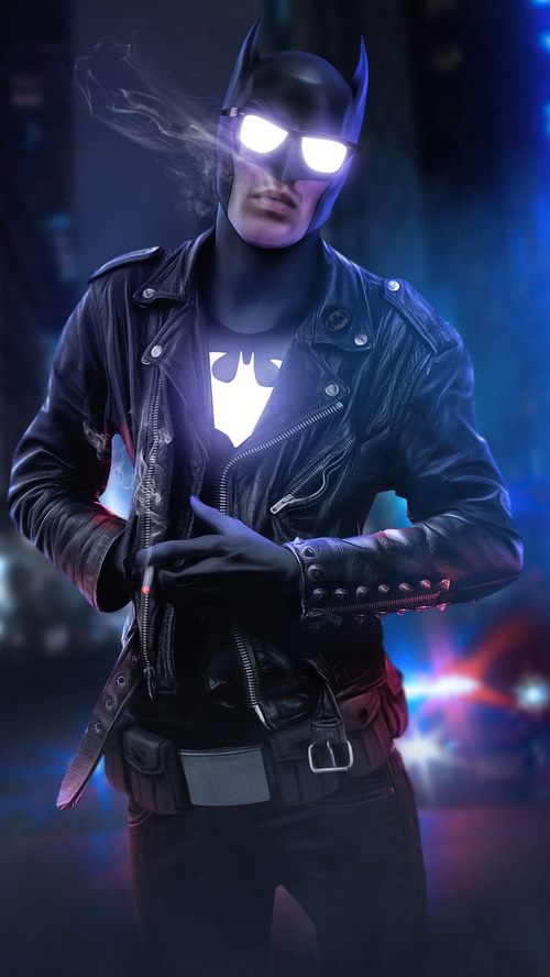 Batman in a leather jacket with sunglasses and smoking