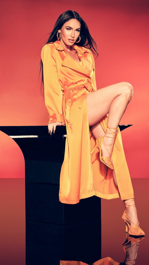 Megan Fox in orange trench coat and heels