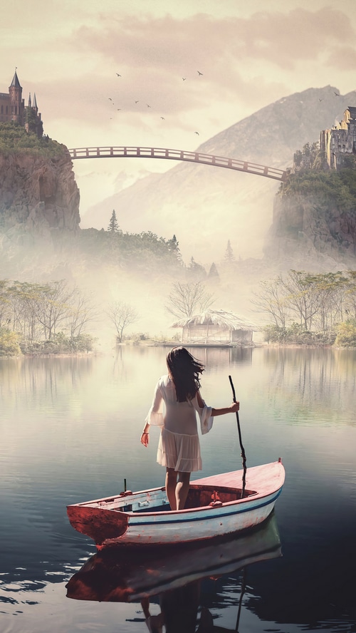 Girl in a boat on a lake with castles