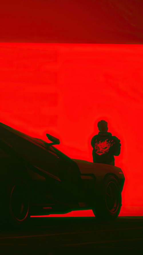 Cyberpunk 2077 character with dragon jacket and car