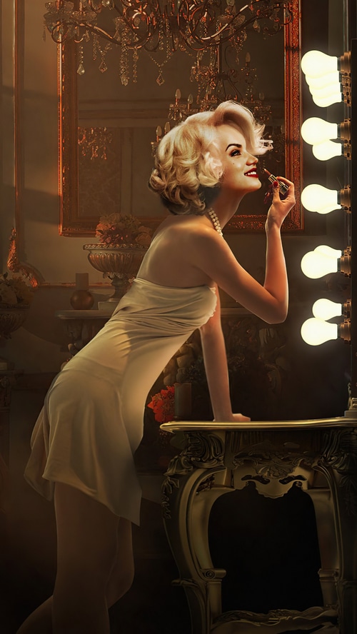Ana de Armas applying lipstick in a dressing room