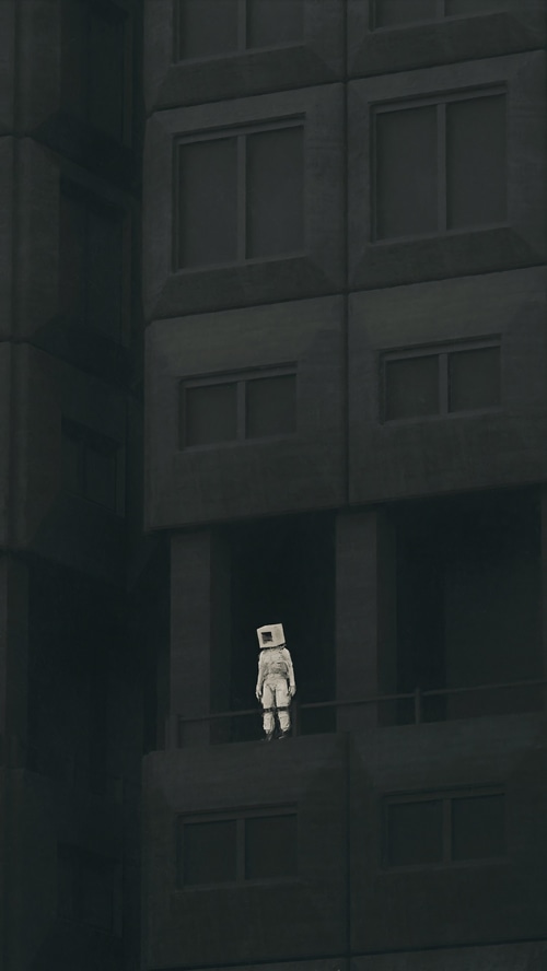 Figure with a box on its head on a balcony