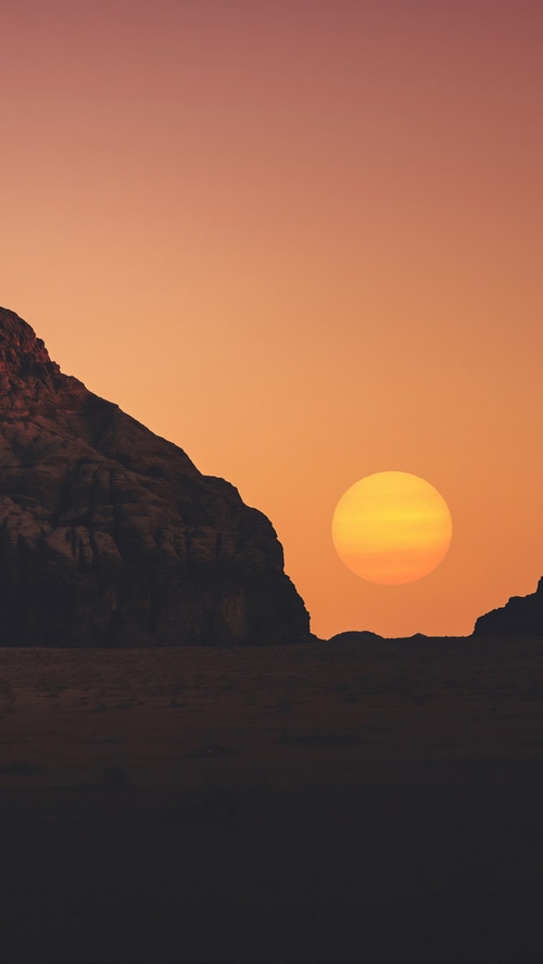 Sunset over rocky desert landscape