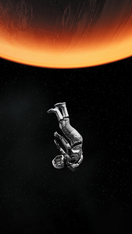 Astronaut falling near a planet in space