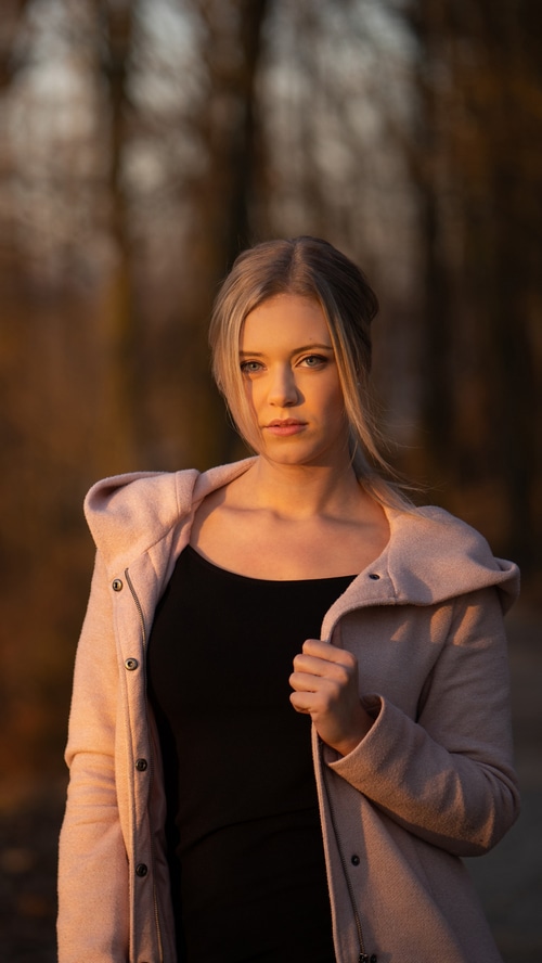 Young woman in a pink coat