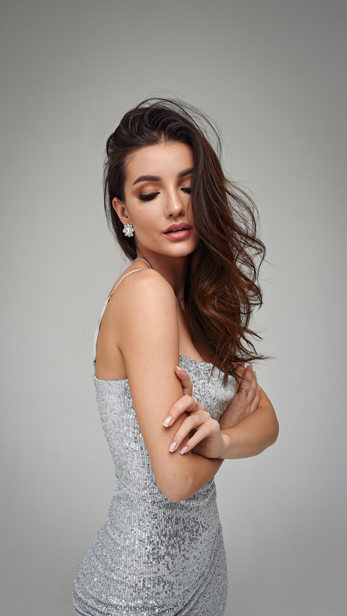 Model in a sequined silver dress