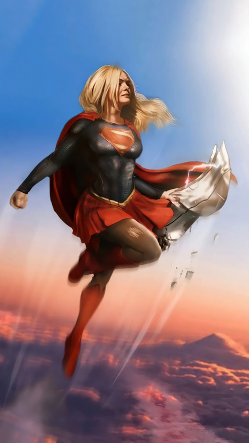 Supergirl flying through the sky at sunset