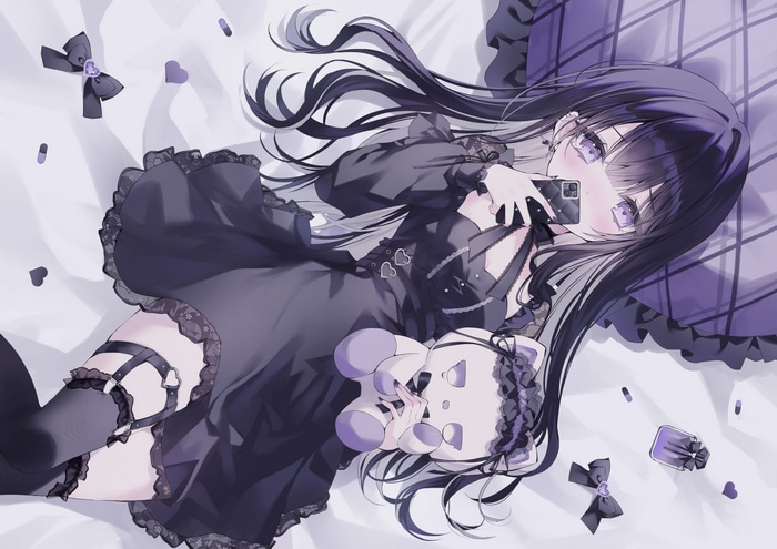 Gothic girl with purple eyes holding a phone