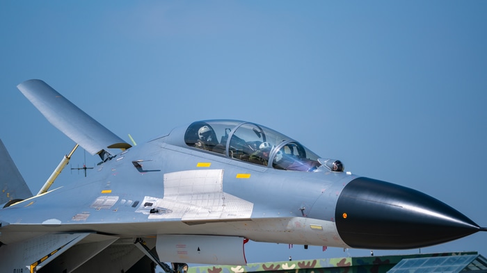 4K J-16 military aircraft cockpit with pilots