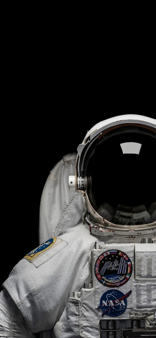 Astronaut in a spacesuit with NASA patch