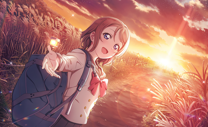 Watanabe You with a lantern at sunset