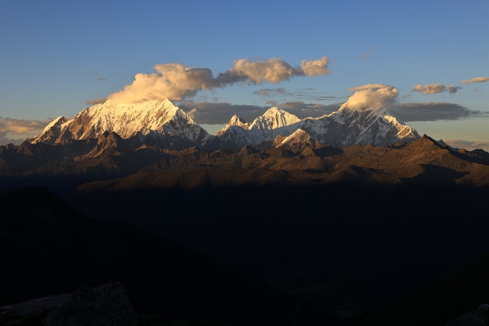 Snow-capped mountains in Tibet at sunset