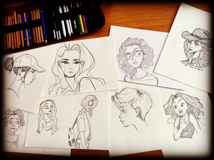 Pencil sketches of women with art supplies