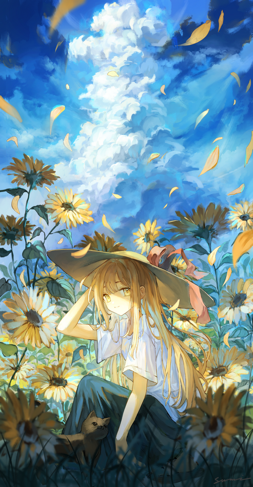 Girl in a sunflower field with a cat