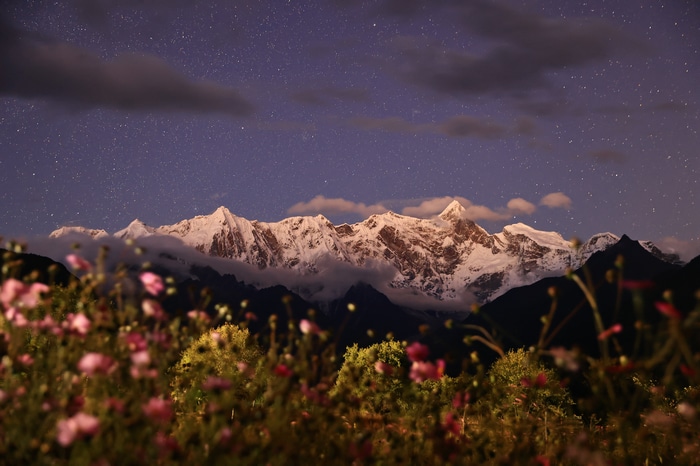 Snowy Peaks in Tibet Under a Starry Sky