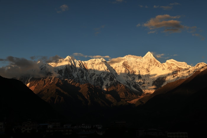 Snowy mountains in Tibet at sunset