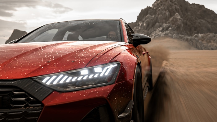 Audi RS6 Avant driving on a dirt road