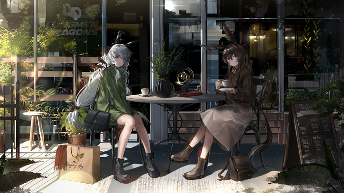 Two girls with animal ears at a cafe