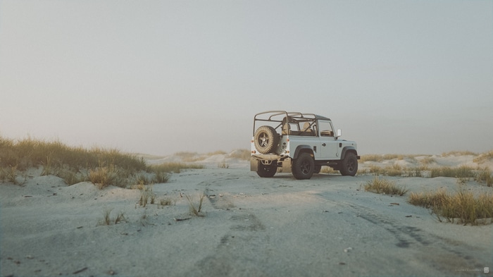 4K White Land Rover Defender SUV on Sand Dunes