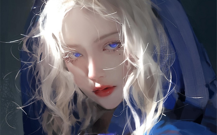Woman with blonde wavy hair and blue eyes
