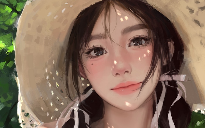 A woman wearing a straw hat with sunlight on her face