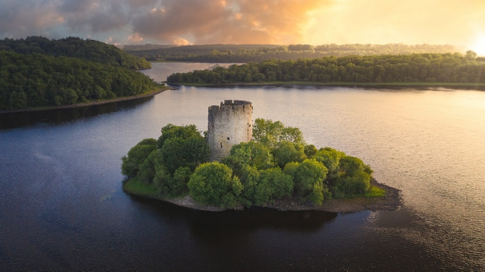 4K Cloughoughter Castle on an island in a lake at sunset