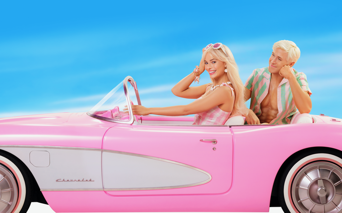 Margot Robbie and Ryan Gosling in a pink Chevrolet