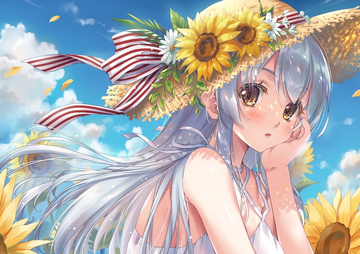 Girl in straw hat with sunflowers