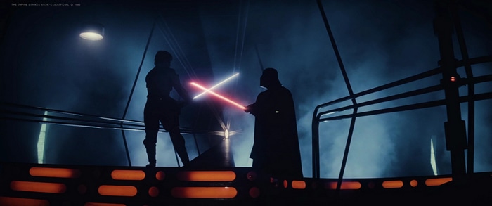 Luke Skywalker and Darth Vader duel with lightsabers