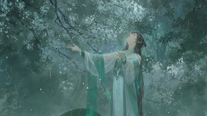 Woman in green dress in the rain under trees
