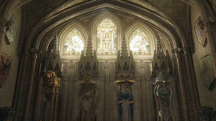 Hogwarts Legacy interior with stained glass windows and statues