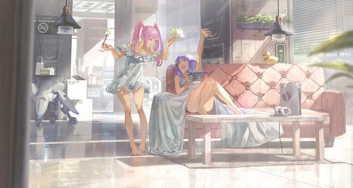 Girls with cake and Nintendo Switch on couch