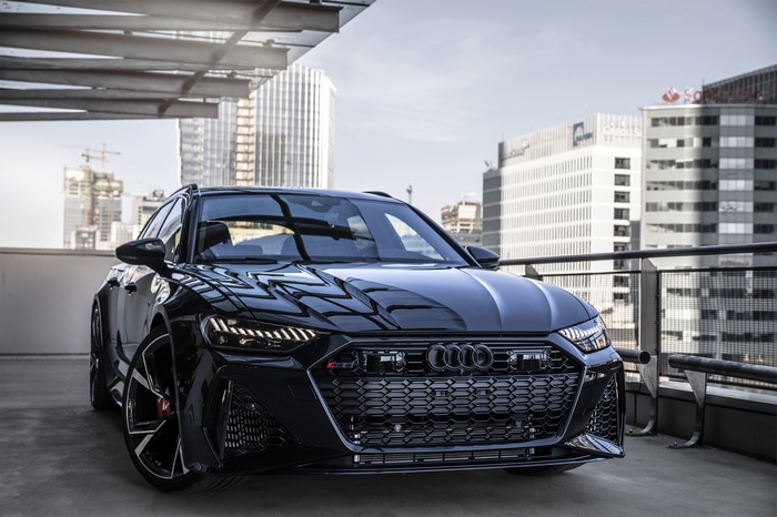 Black Audi RS6 Avant parked in a city parking lot