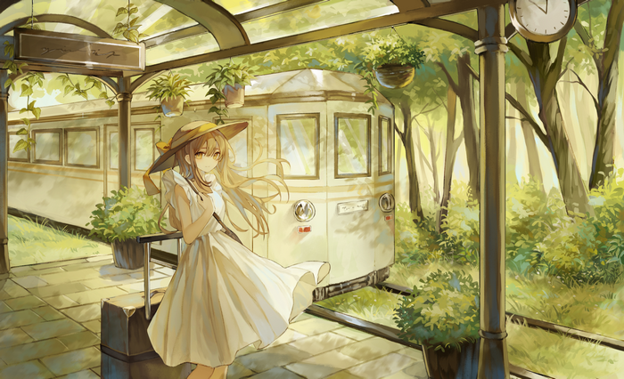 Girl with hat and suitcase at a train station