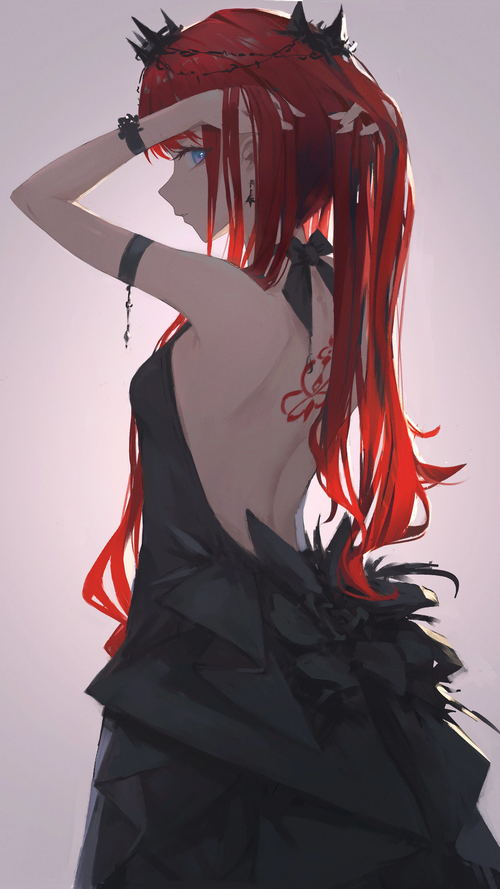 Redhead woman in black dress with tattoo