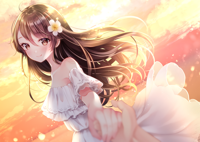 Girl in white dress holding hands at sunset