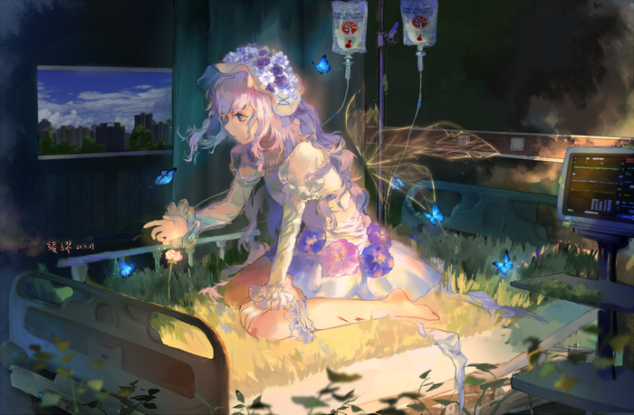Girl in a hospital bed with butterflies and flowers