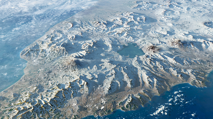 Aerial view of snow-covered mountains and volcanoes