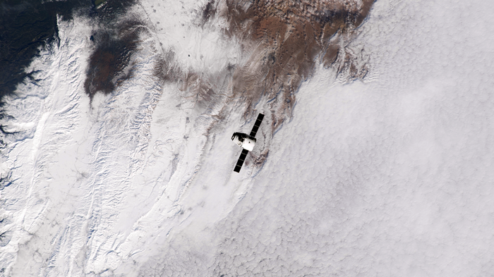 SpaceX Spaceship Over Snowy Earth