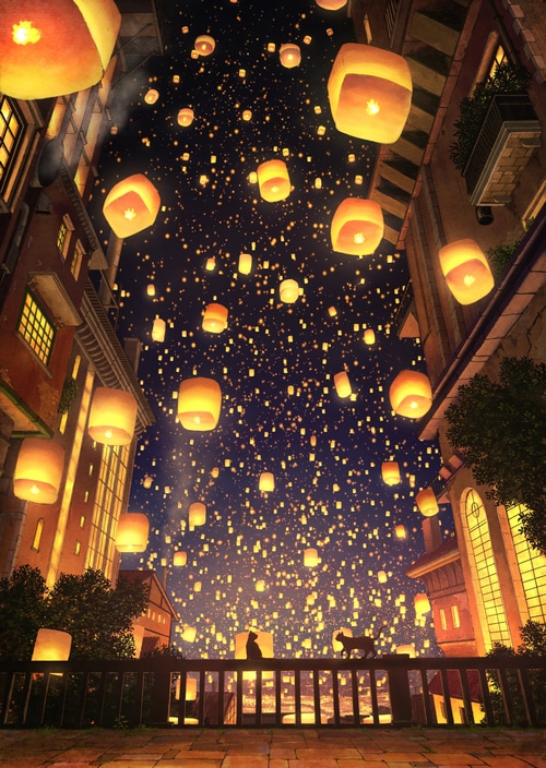 A night sky filled with lanterns over a city street
