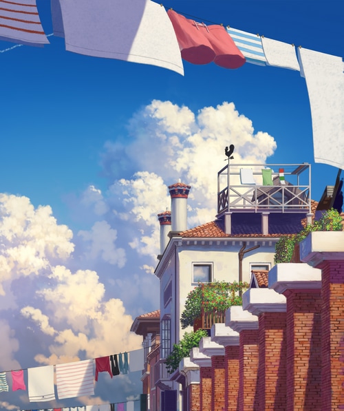 Clothes drying on a line with buildings and clouds
