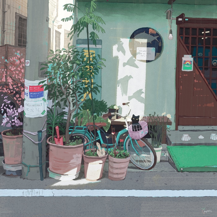 Black cat on a bicycle with plants