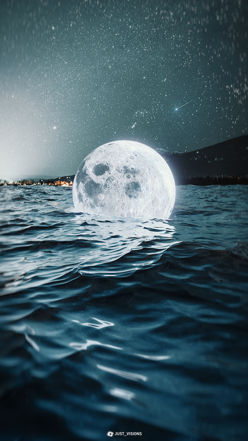 Moon rising over the ocean under a starry sky