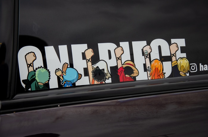 One Piece characters sticker on a car