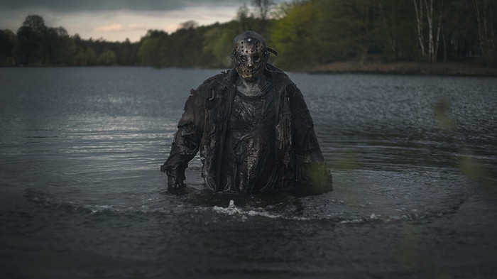 Jason Voorhees standing in a lake