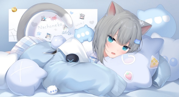 Amashiro Natsuki lying on pillows with cat ears and tail