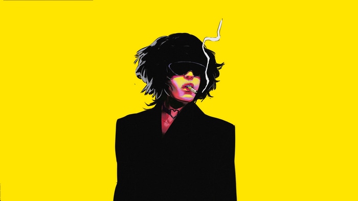 Woman with sunglasses smoking cigarette on yellow background