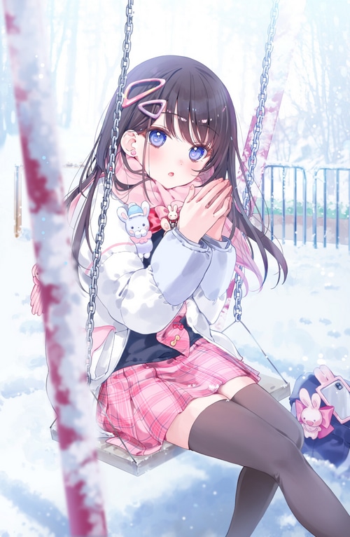 Girl with dark hair and blue eyes on a swing in the snow