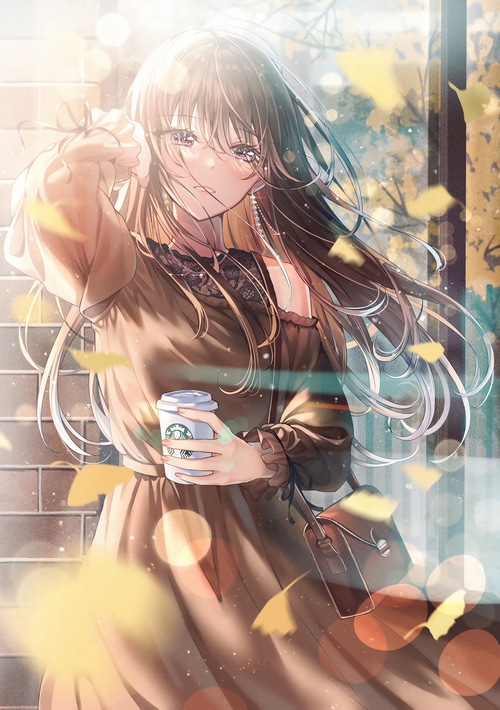 Girl holding Starbucks cup with leaves and sunlight