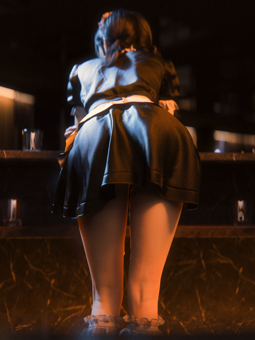 Woman in maid outfit bent over at a bar